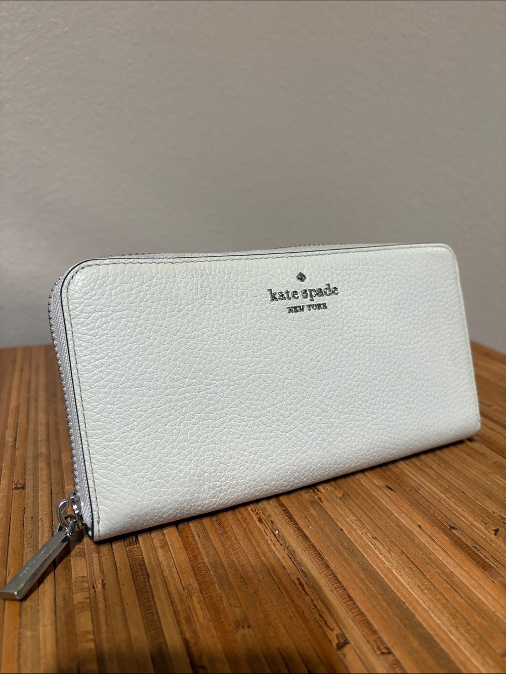 kate spade White Pebbled Leather Zip Wallet with Silver Hardware